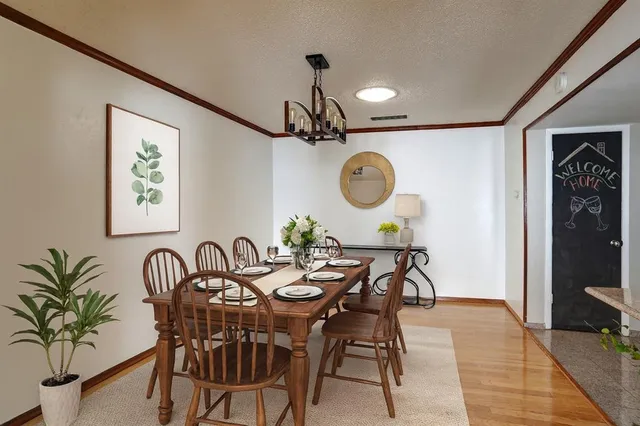 a view of a room with wooden floor