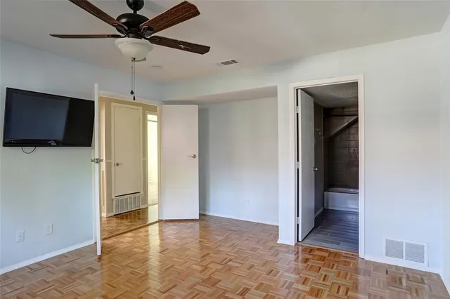 a bathroom with a sink a toilet a mirror and shower