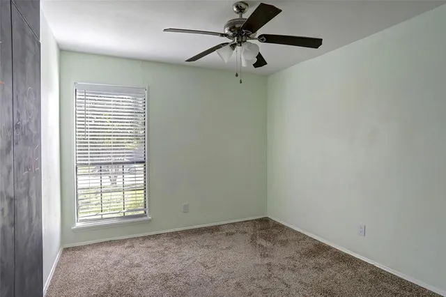 a bathroom with a toilet sink and shower