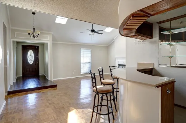 a kitchen with stainless steel appliances granite countertop a sink and a refrigerator
