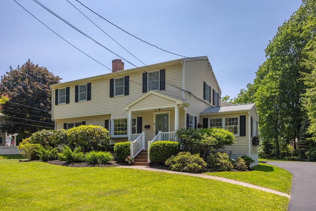 64 Reed Street Lexington, MA 02421 - Photo 2 of 12 a front view of a house with a yard