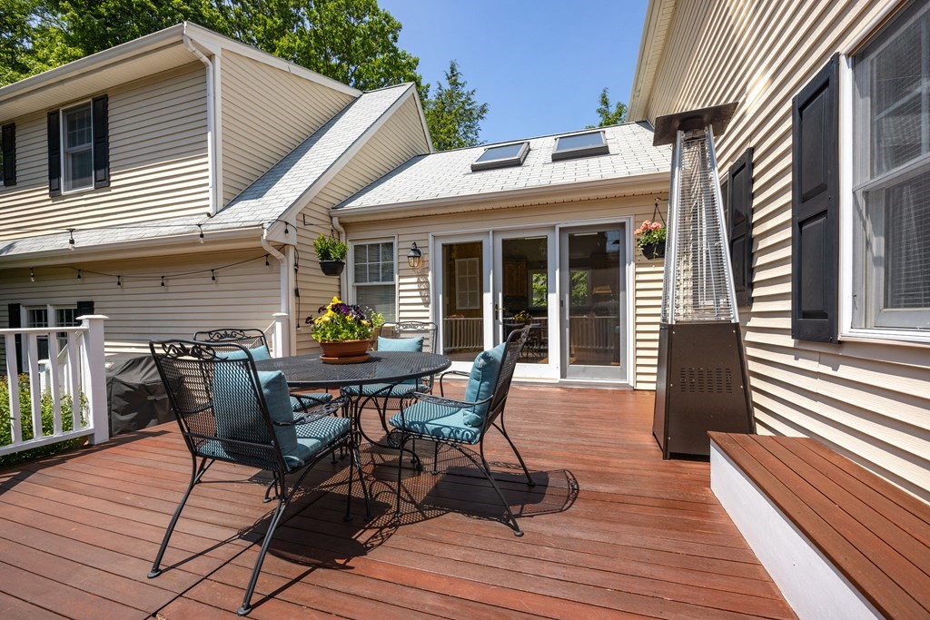 64 Reed Street Lexington, MA 02421 - Photo 8 of 12 a view of a house with patio and wooden floor