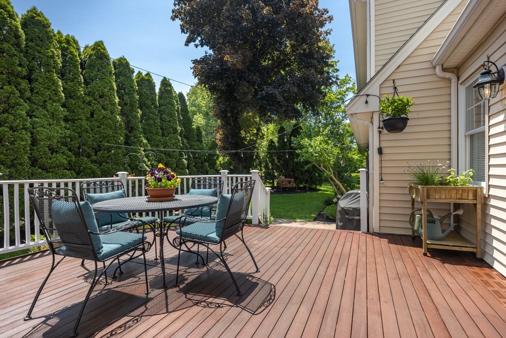 64 Reed Street Lexington, MA 02421 - Photo 9 of 12 a view of a deck with wooden floor and outdoor seating