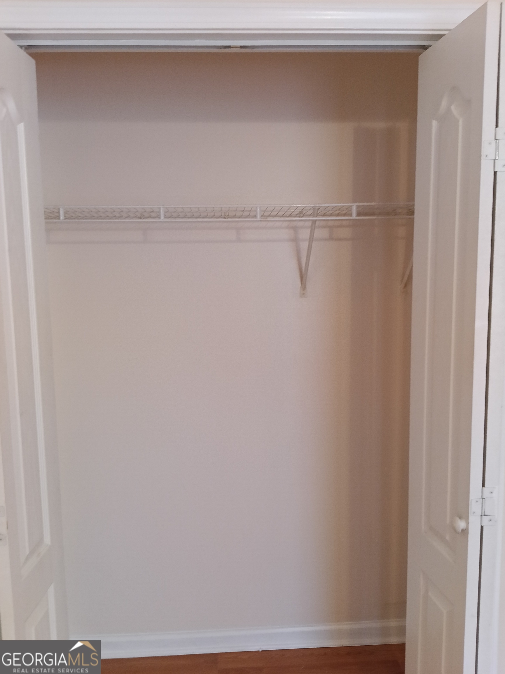 3049 Fields Drive Lithonia, GA 30038 - Photo 12 of 14 a view of walk in closet with empty racks