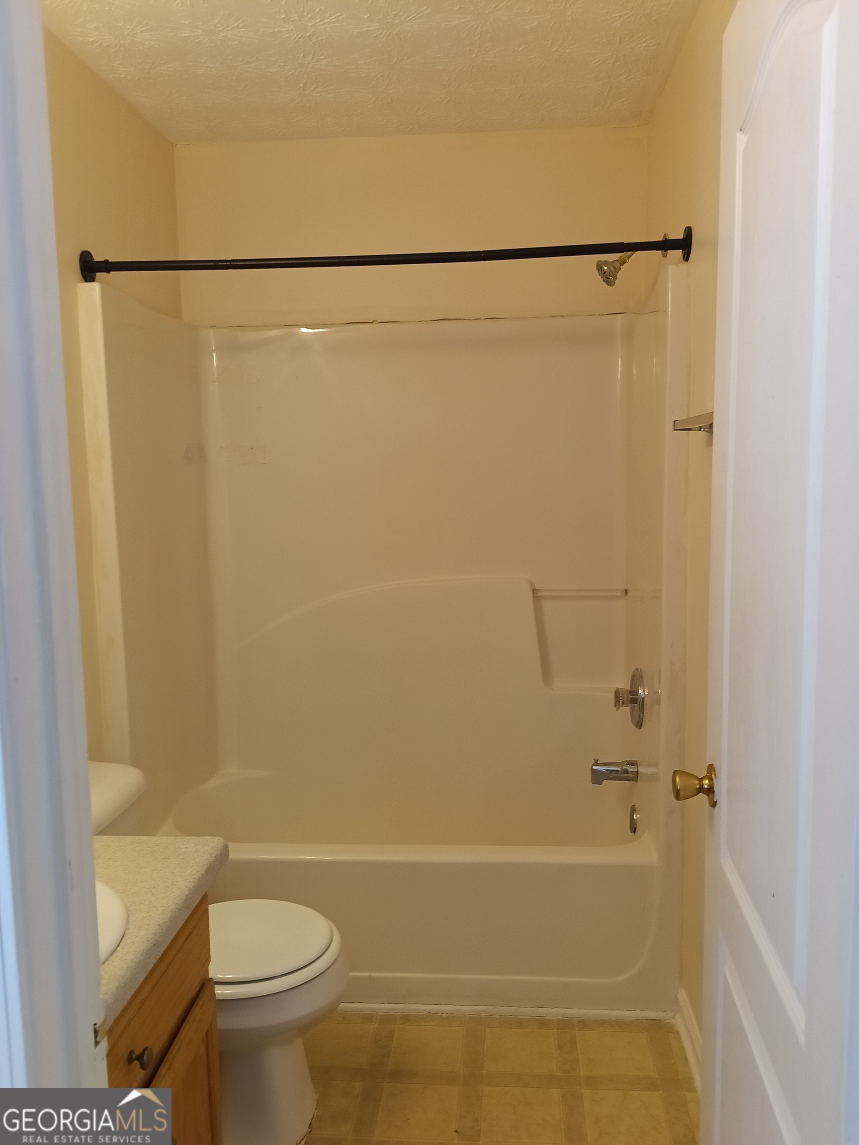 3049 Fields Drive Lithonia, GA 30038 - Photo 14 of 14 a bathroom with a shower and a toilet