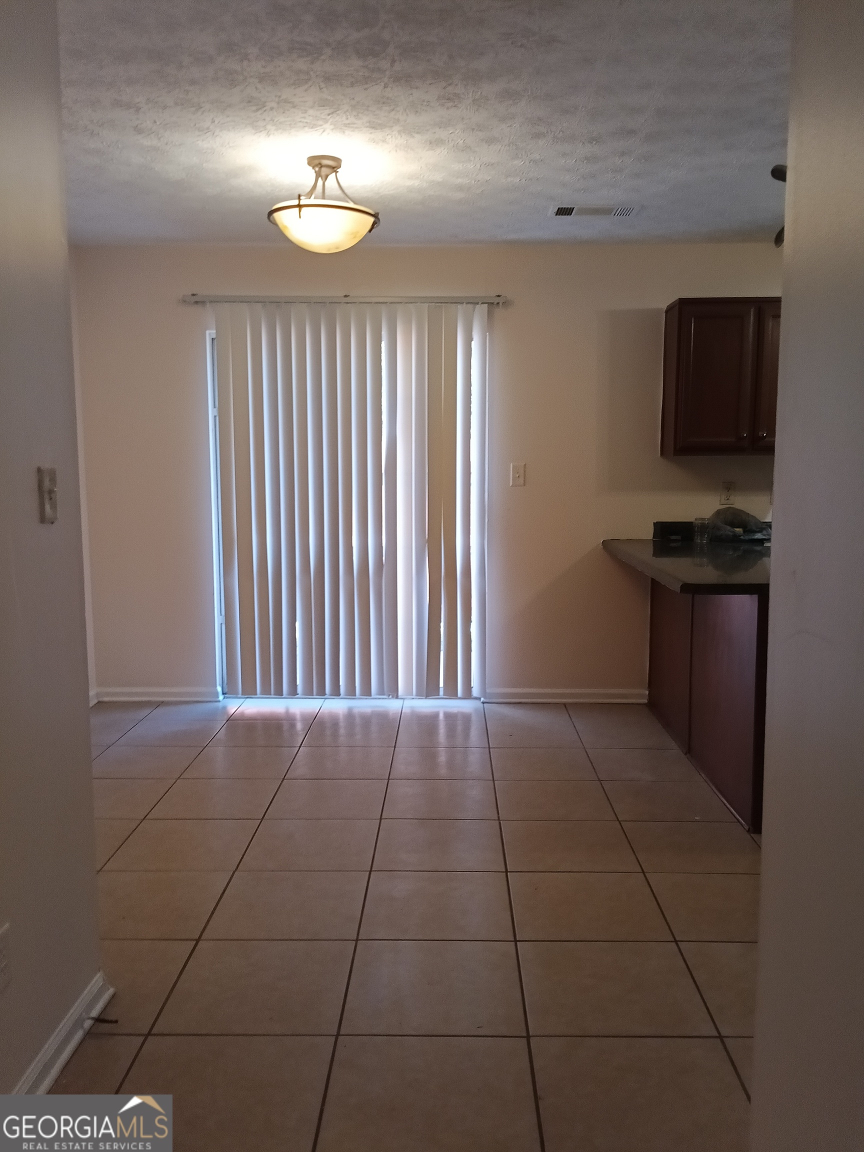 3049 Fields Drive Lithonia, GA 30038 - Photo 6 of 14 a view of an empty room with a kitchen