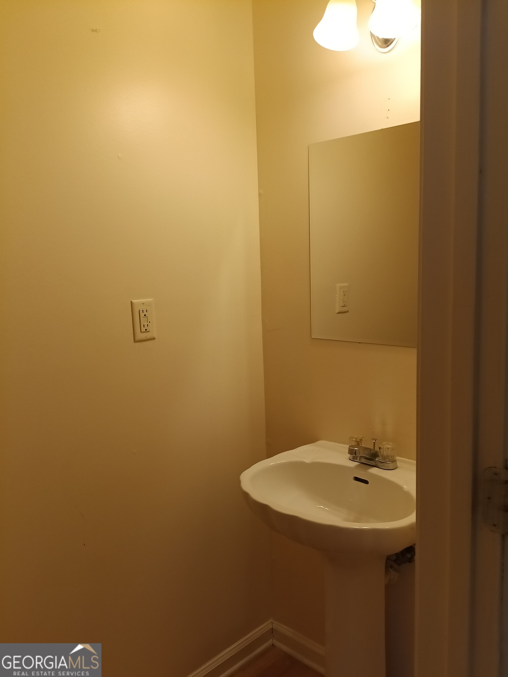 3049 Fields Drive Lithonia, GA 30038 - Photo 8 of 14 a bathroom with a sink and mirror