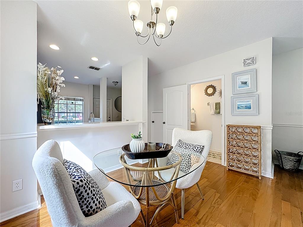 10300 Manderley Way, Unit 119 Orlando, FL 32829 - Photo 11 of 42 a dining room with furniture and window