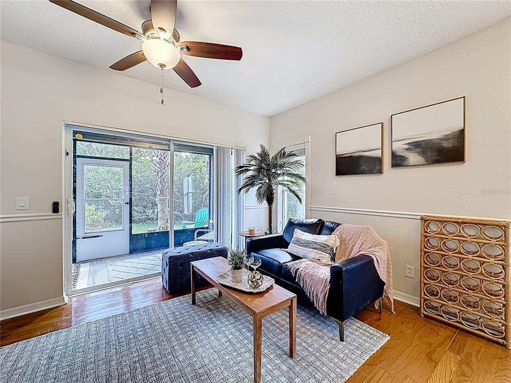 10300 Manderley Way, Unit 119 Orlando, FL 32829 - Photo 14 of 42 a living room with furniture and a large window