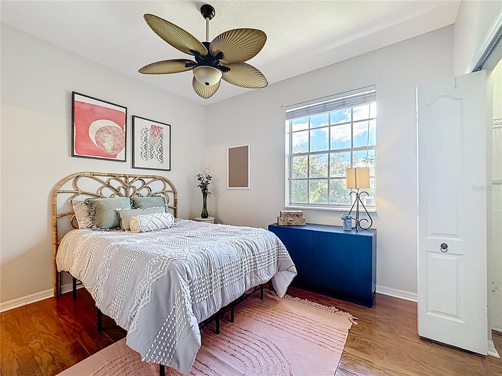 10300 Manderley Way, Unit 119 Orlando, FL 32829 - Photo 16 of 42 a bedroom with a large bed and a window