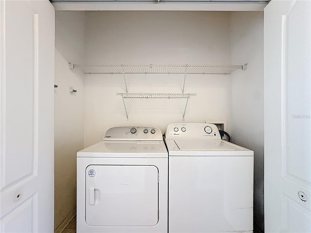 10300 Manderley Way, Unit 119 Orlando, FL 32829 - Photo 26 of 42 a utility room with dryer and washer
