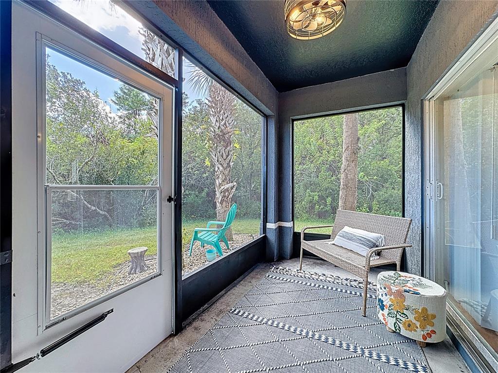10300 Manderley Way, Unit 119 Orlando, FL 32829 - Photo 28 of 42 a living room with furniture and a large window