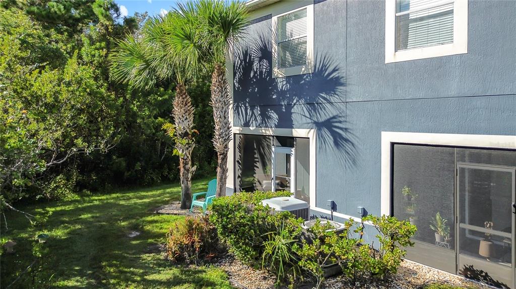 10300 Manderley Way, Unit 119 Orlando, FL 32829 - Photo 30 of 42 a front view of a house with a yard