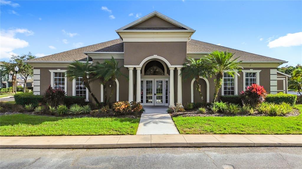 10300 Manderley Way, Unit 119 Orlando, FL 32829 - Photo 36 of 42 a front view of a house with garden
