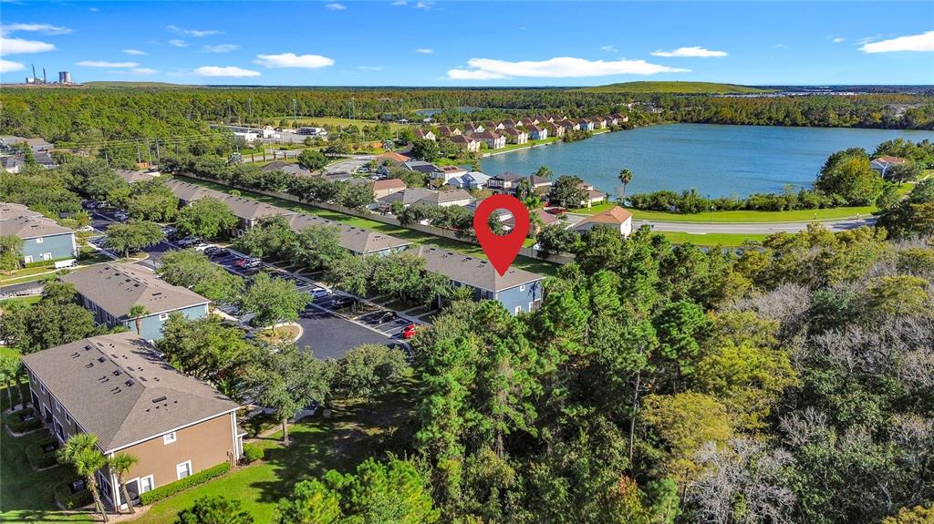 10300 Manderley Way, Unit 119 Orlando, FL 32829 - Photo 40 of 42 an aerial view of residential houses with outdoor space and lake view