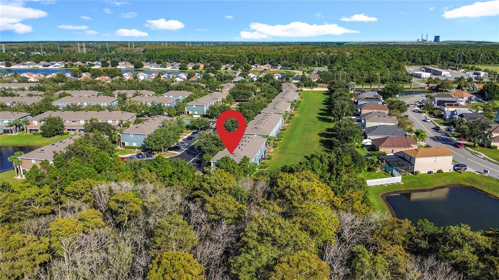 10300 Manderley Way, Unit 119 Orlando, FL 32829 - Photo 42 of 42 an aerial view of residential houses with outdoor space and trees