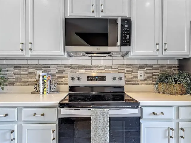 a kitchen with a stove and a sink