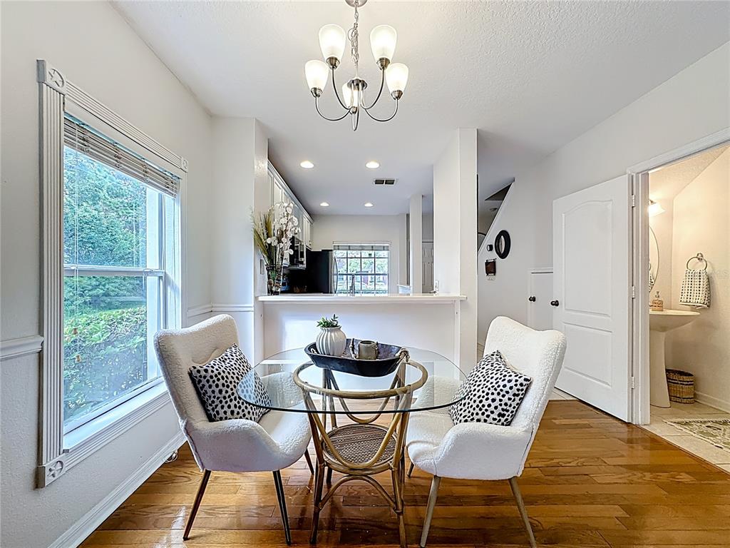 10300 Manderley Way, Unit 119 Orlando, FL 32829 - Photo 10 of 42 a dining room with furniture and window