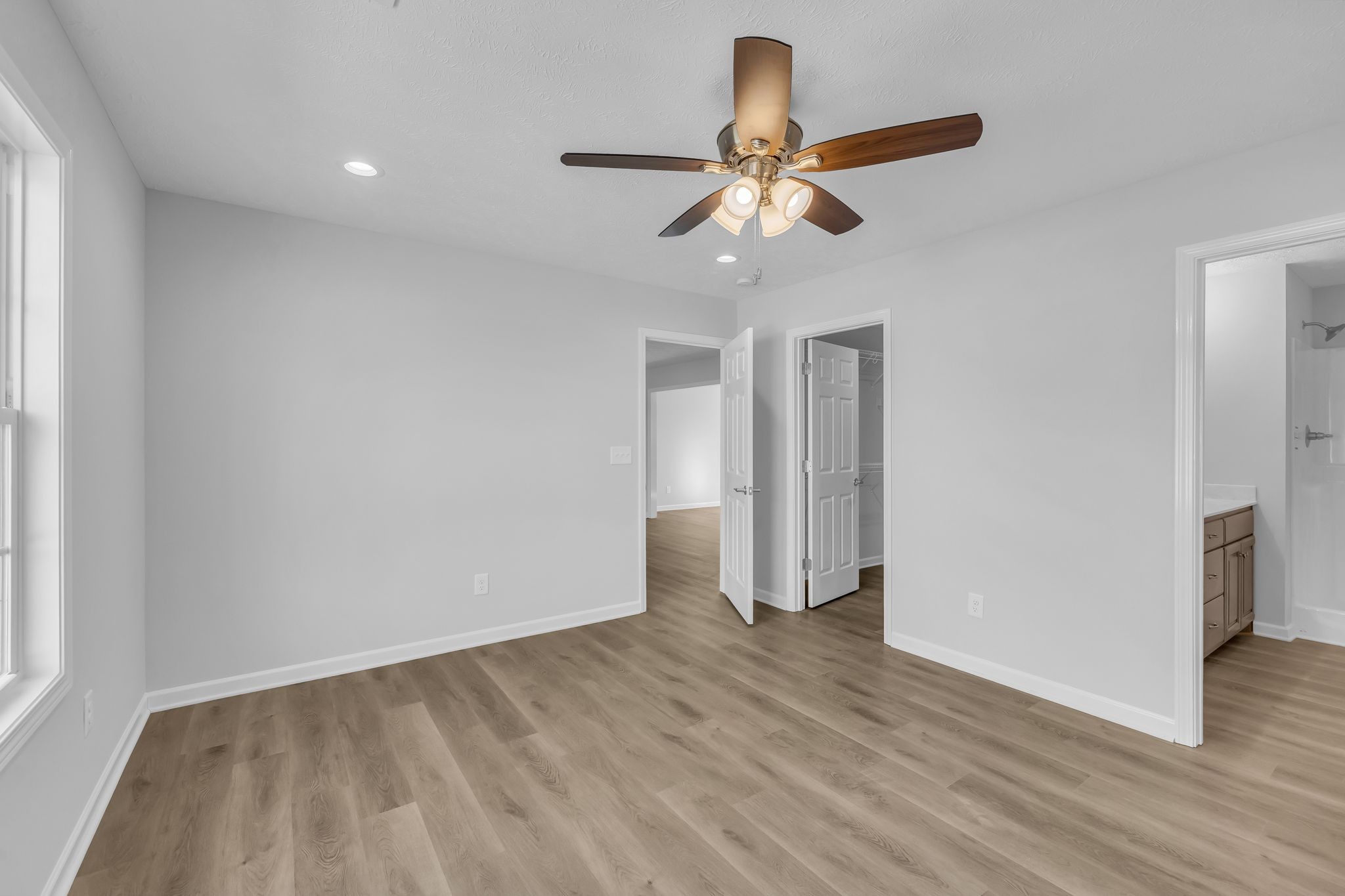 638 Summitville Road Manchester, TN 37355 - Photo 17 of 33 a view of an empty room with wooden floor and a window