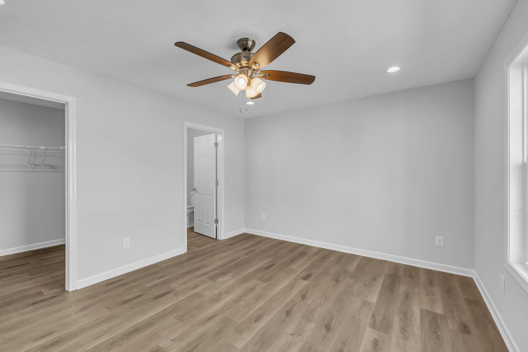 638 Summitville Road Manchester, TN 37355 - Photo 18 of 33 wooden floor in an empty room with a window