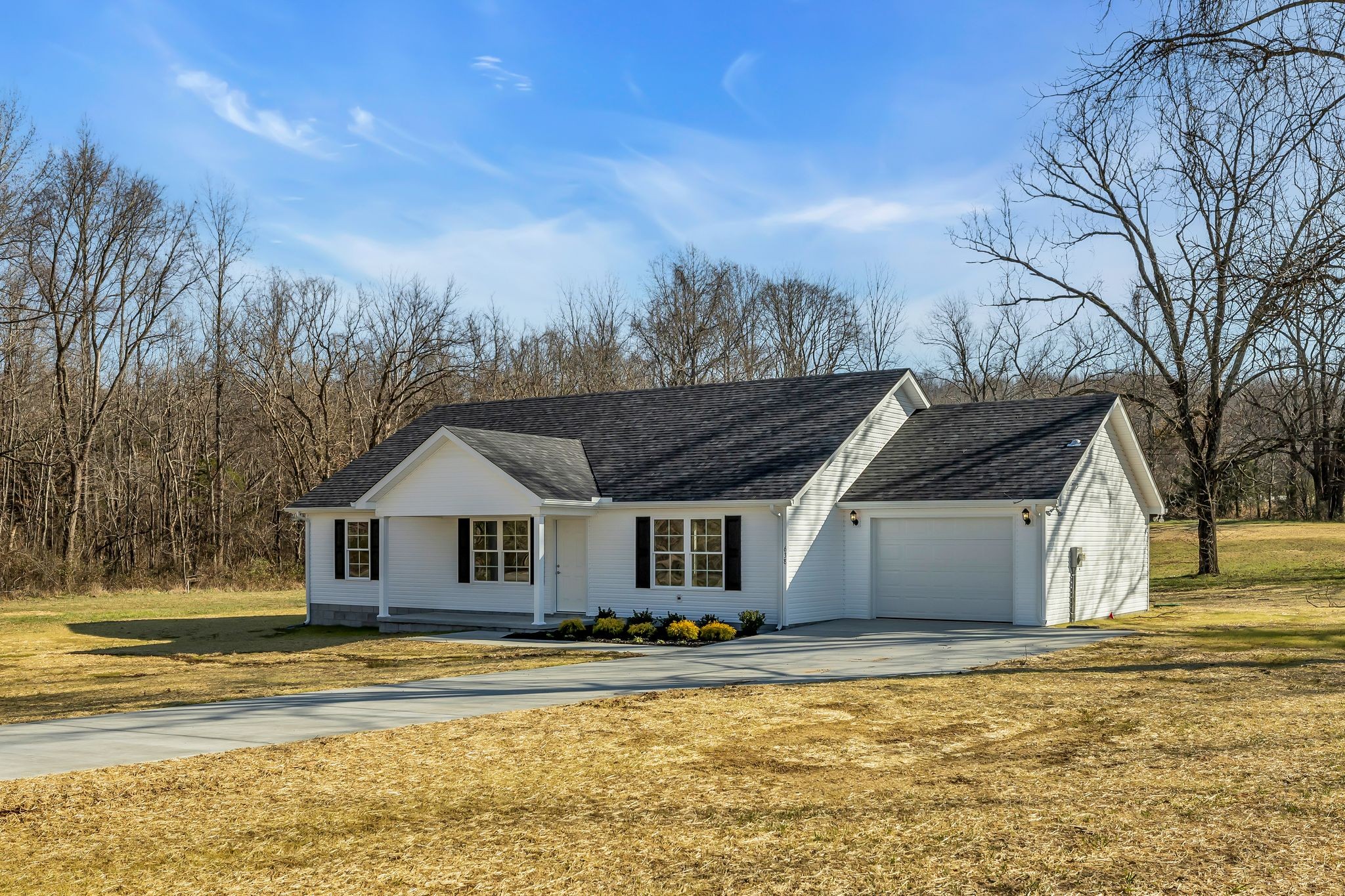 638 Summitville Road Manchester, TN 37355 - Photo 3 of 33 a front view of a house with a garden and tree