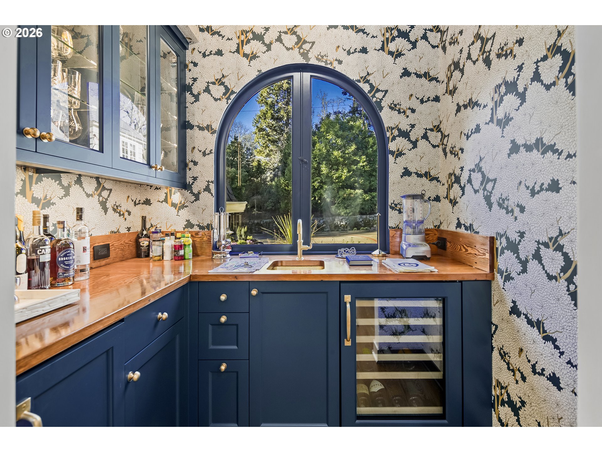 1905 South Greenwood Road Portland, OR 97219 - Photo 19 of 46 a kitchen with stainless steel appliances a sink a stove and a wooden floor