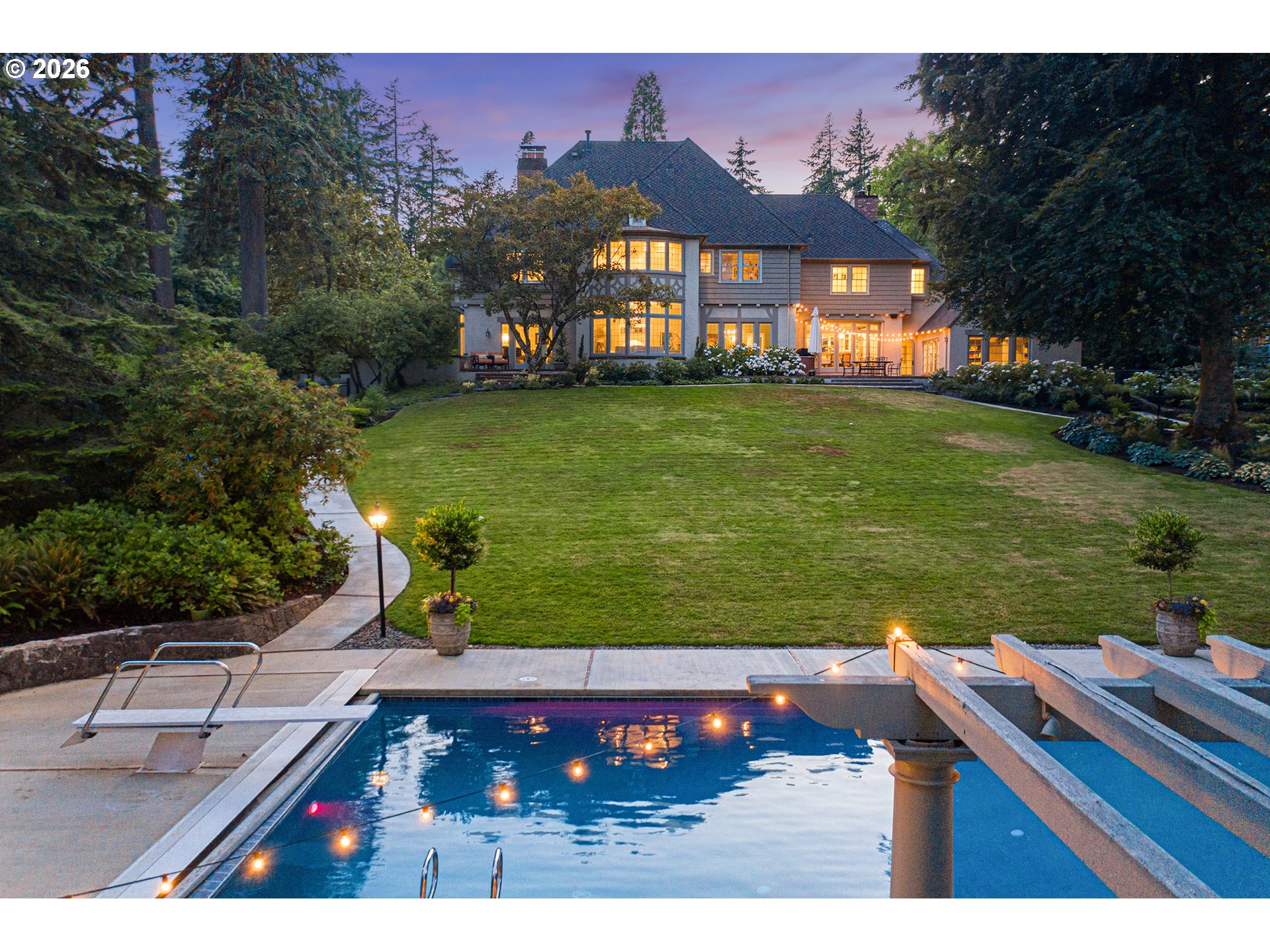 1905 South Greenwood Road Portland, OR 97219 - Photo 2 of 46 a view of a big house with a big yard