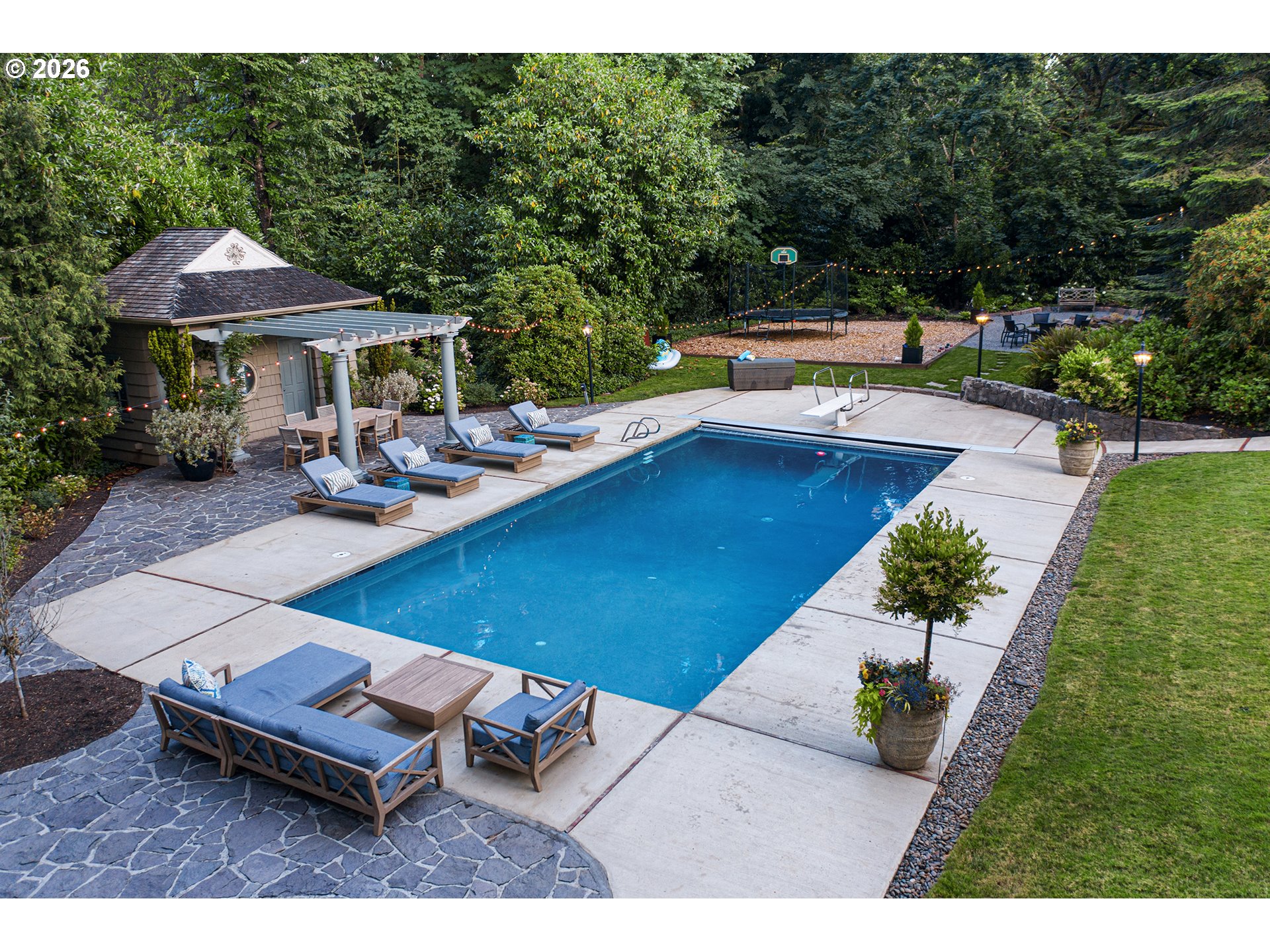 1905 South Greenwood Road Portland, OR 97219 - Photo 39 of 46 a view of a swimming pool with lounge chairs in patio