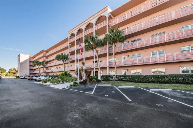 a view of swimming pool with outdoor seating and plants