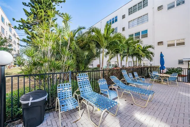 a view of a chairs and table in the garden