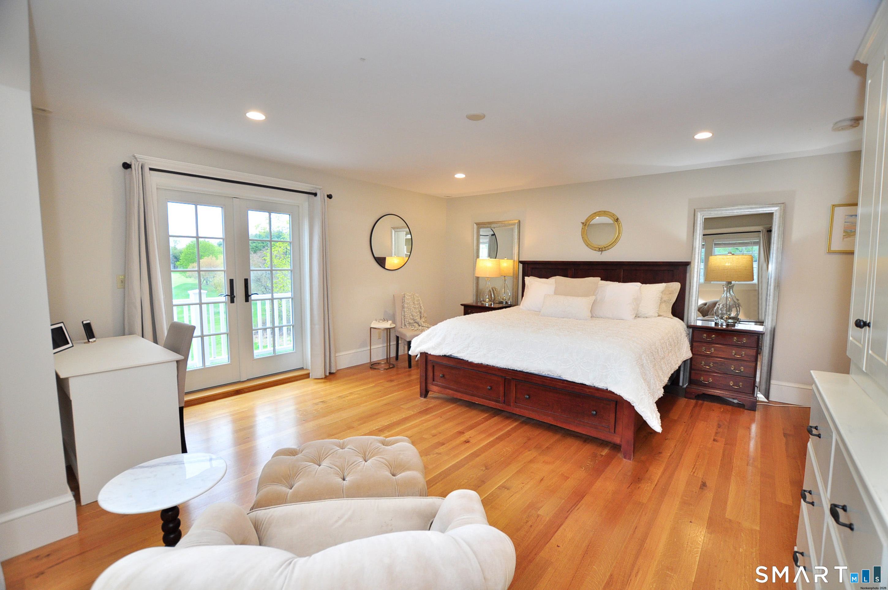 371 North Main Street Suffield, CT 06078 - Photo 19 of 39 a bedroom with a bed and wooden floor