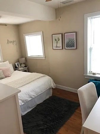 61 Wait Street, Unit 3 Boston, MA 02120 - Photo 4 of 10 a bedroom with a bed and window