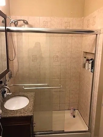 61 Wait Street, Unit 3 Boston, MA 02120 - Photo 8 of 10 a bathroom with a sink and a shower