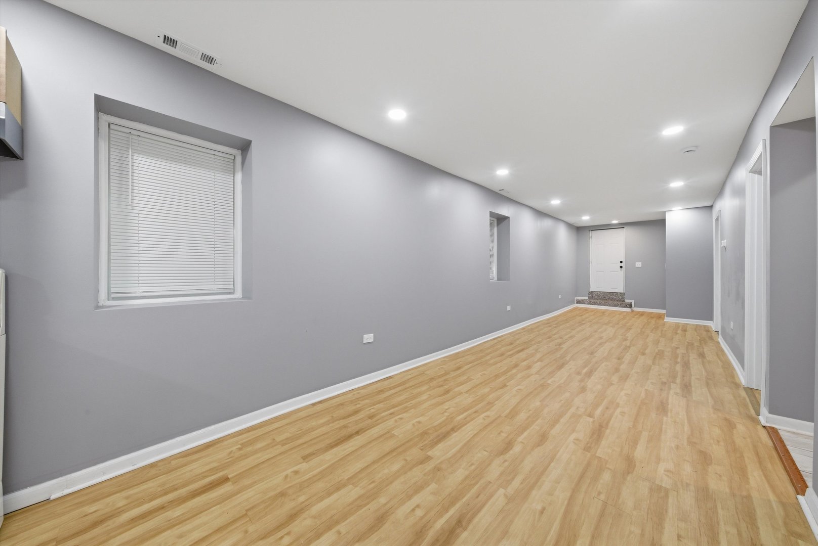 7828 South Escanaba Avenue Chicago, IL 60649 - Photo 29 of 41 a view of empty room with wooden floor