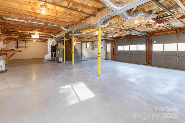 a view of water heater room with a garage