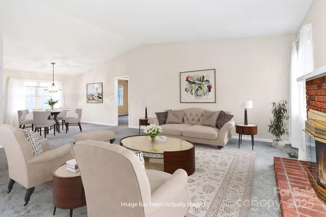 a living room with furniture a rug and a fireplace