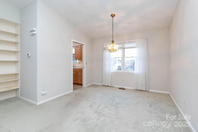 an empty room that has a window