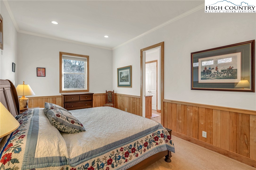 933 Thunder Ridge Lane Lenoir, NC 28645 - Photo 34 of 45 a bedroom with a bed and wooden floor