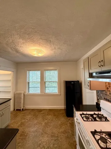 a view of kitchen and windows