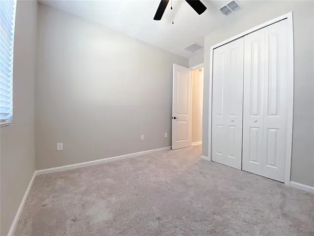 a bathroom with a granite countertop shower