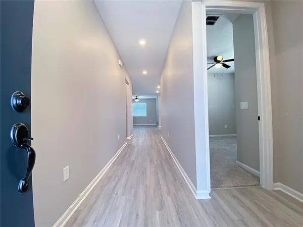 a view of a livingroom with wooden floor