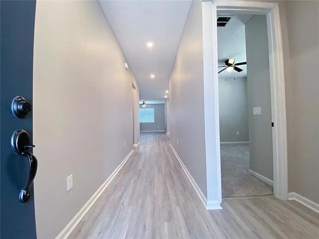 a view of a livingroom with wooden floor