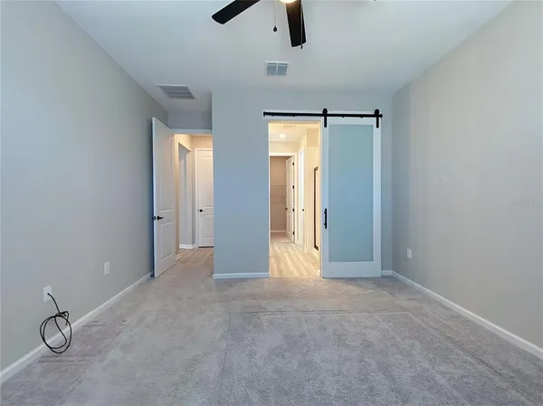 a bathroom with a double vanity sink mirror and shower