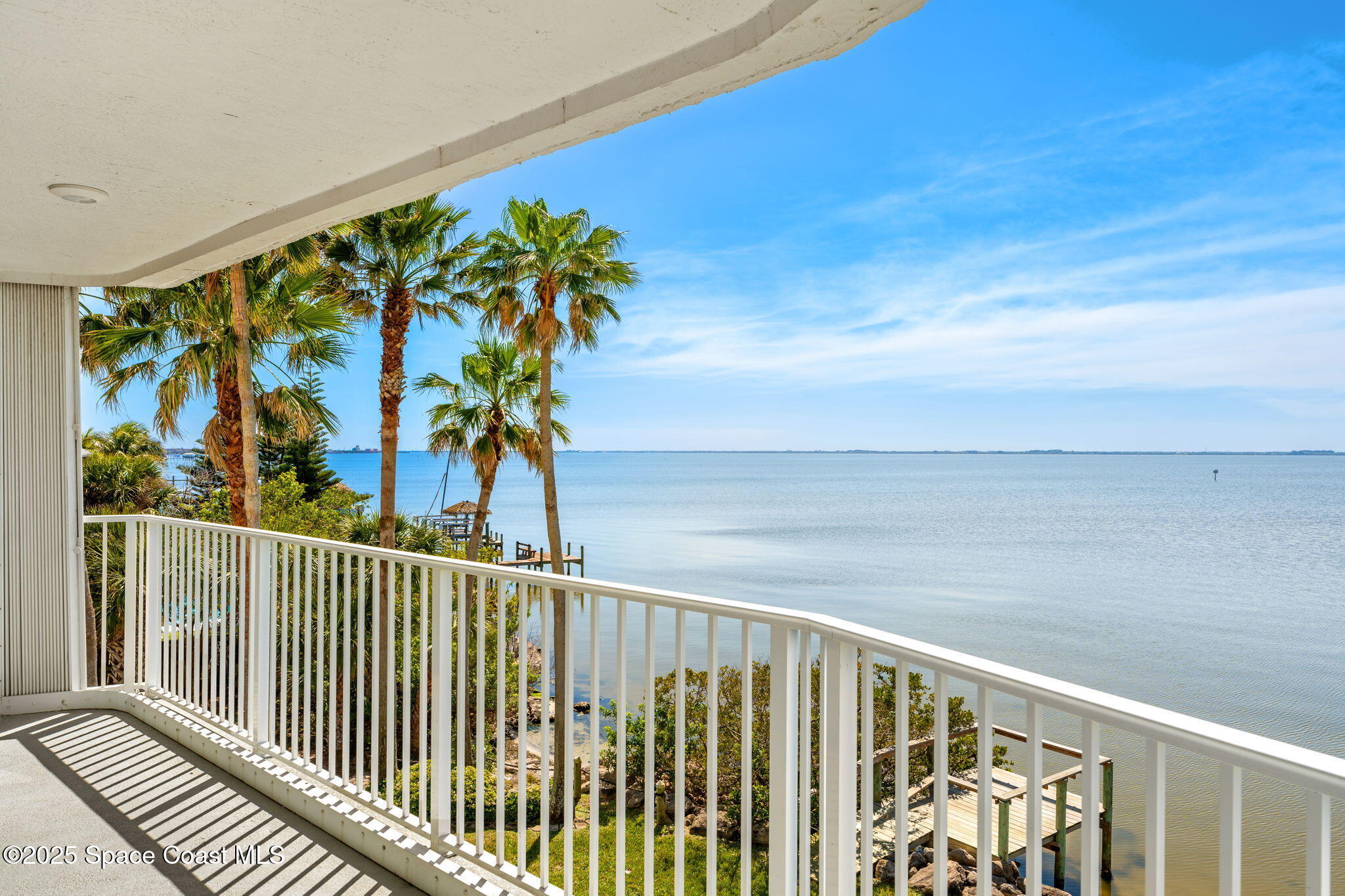 210 24th Street, Unit 301 Cocoa Beach, FL 32931 - Photo 1 of 44 a view of a balcony with plants
