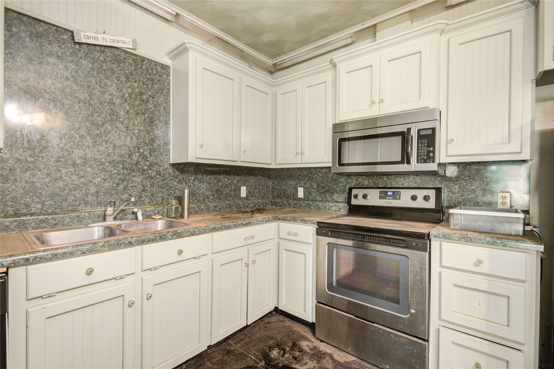 508 East 2nd Street Sweeny, TX 77480 - Photo 15 of 41 a kitchen with cabinets stainless steel appliances and sink
