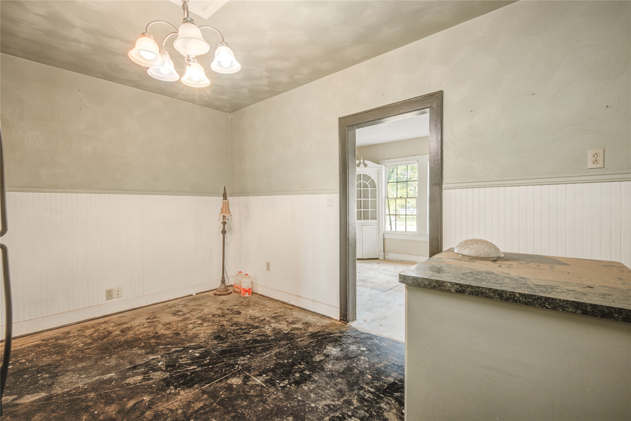 508 East 2nd Street Sweeny, TX 77480 - Photo 16 of 41 a bedroom with a bed and a chandelier
