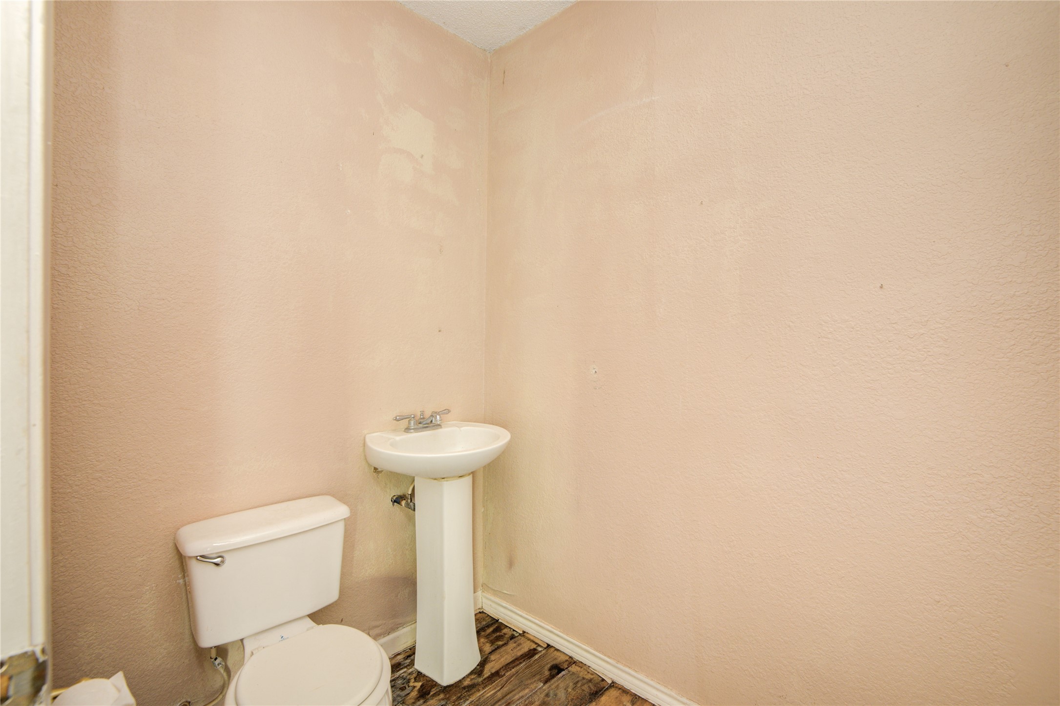 508 East 2nd Street Sweeny, TX 77480 - Photo 32 of 41 a white toilet sitting next to a white wall