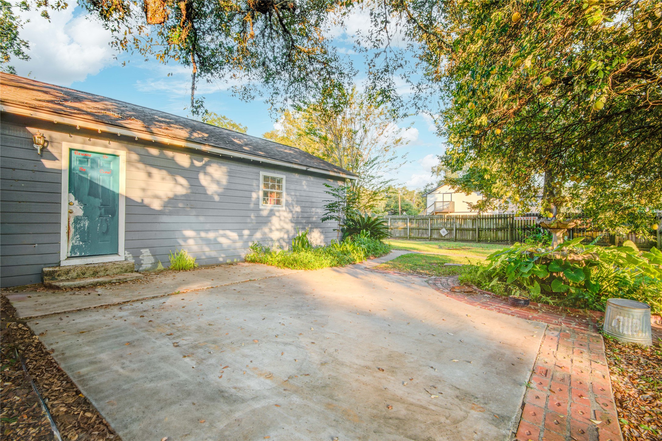 508 East 2nd Street Sweeny, TX 77480 - Photo 33 of 41 a view of a house with a yard and garage