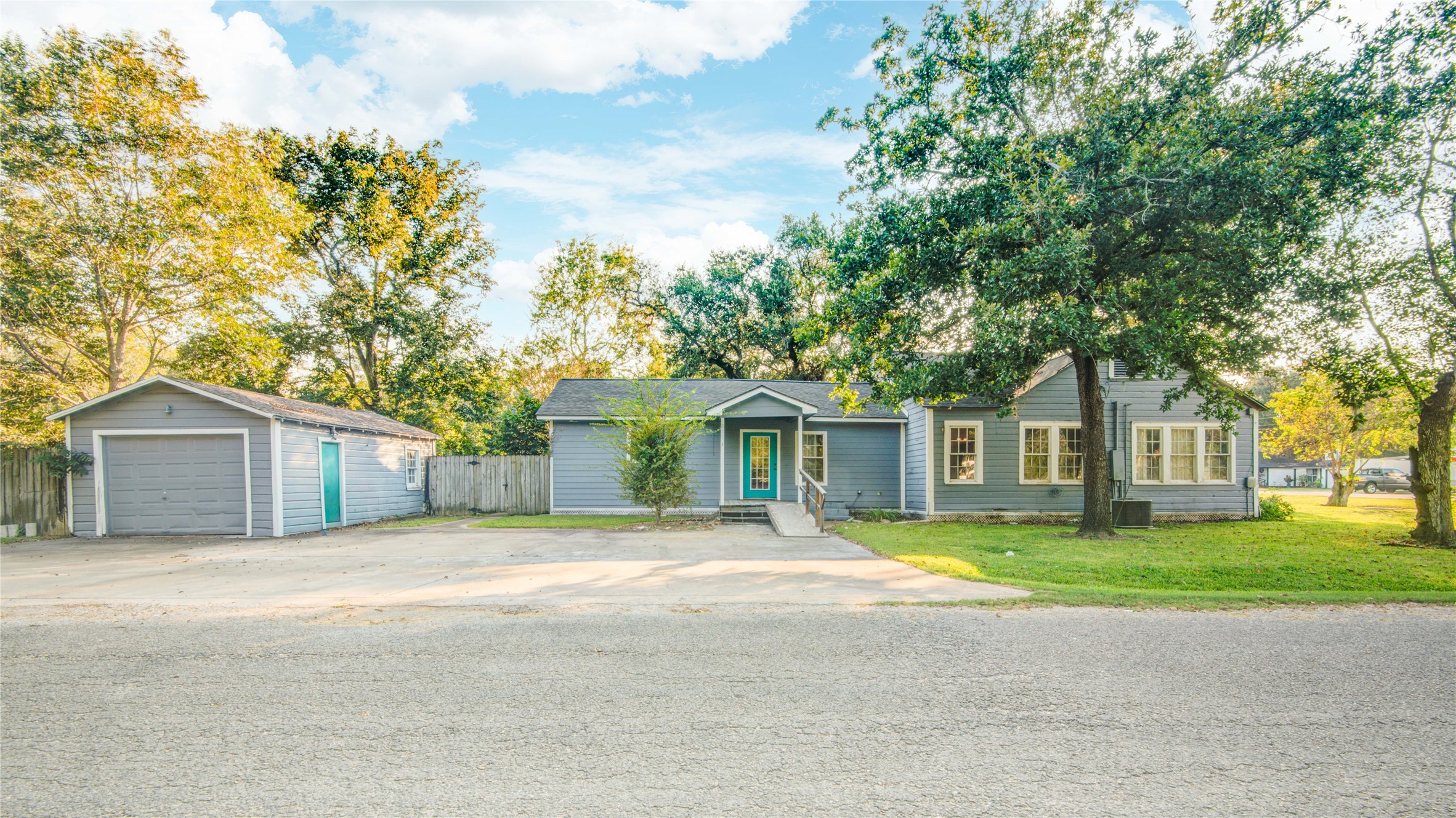 508 East 2nd Street Sweeny, TX 77480 - Photo 34 of 41 a front view of a house with a garden and trees