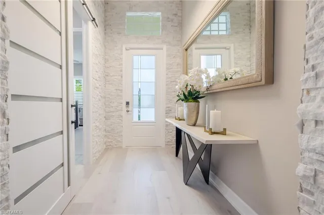 a room with a window a sink and entryway